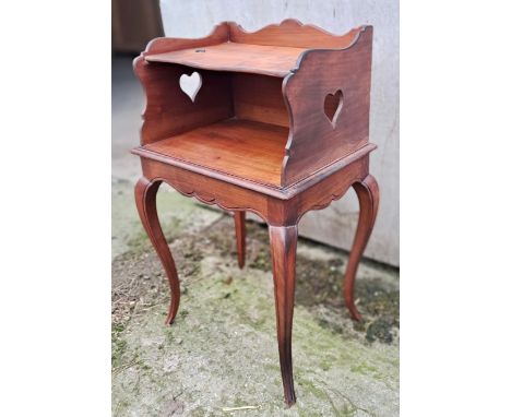 A 19thC cabinet with folding top shelf on cabriole legs with heart shaped cutouts to either side. 73cm h x 45cm w x 35cm d.
