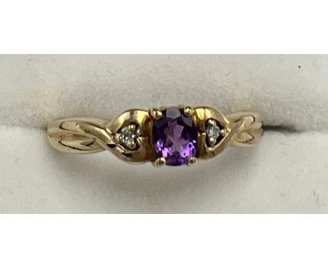 A 9 carat gold amethyst and diamond set ring, size P. Weight 2.5gm.