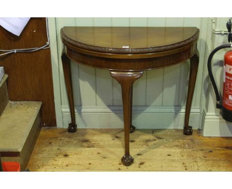Early 20th Century mahogany demi lune fold top card table on ball and claw legs, 74cm by 85cm (closed)