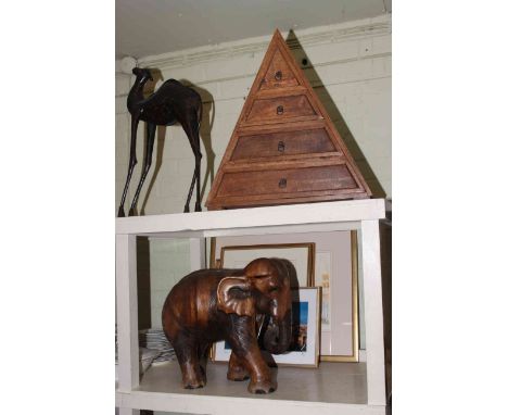 Small four drawer pyramid chest, carved wood elephant, tin model camel, four prints and photograph