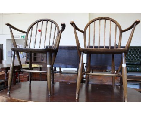 A set of three Ercol dining chairs including two carvers