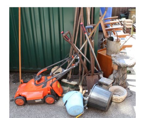 A Flymo lawn mower, an assortment of tools, a weathered bird bath etc