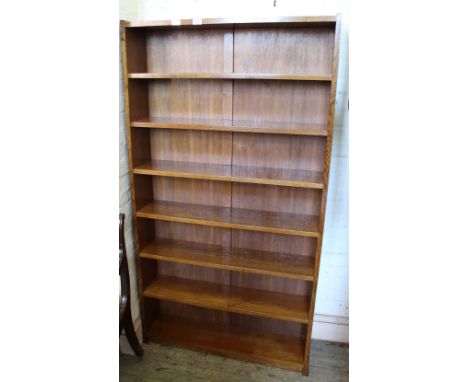 An oak seven shelf bookcase