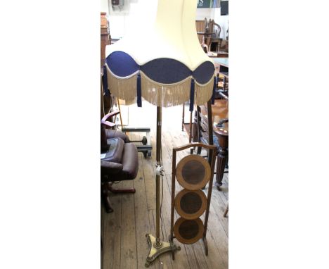 A brass Corinthian column standard lamp and a cake stand