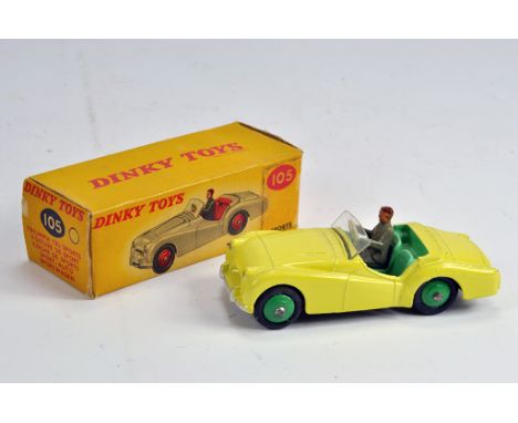 Dinky Toys No.105 Triumph TR2 Sports Car. Pale yellow body, light green interior with driver; green hubs, smooth tyres. NM in