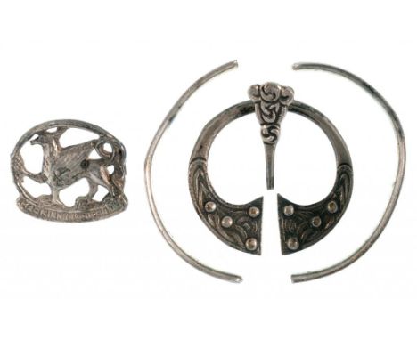 AN IONA SILVER BROOCH BY ALEXANDER RITCHIE, MAKER'S MARK INCUSE, ALSO MARKED IONA AND RD NO654745, A REEDED SILVER BANGLE, BY