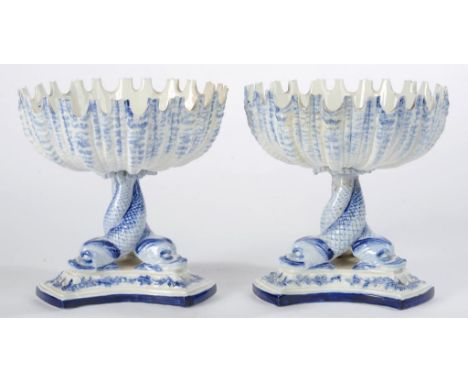 A PAIR OF ROYAL WORCESTER SHELL ON DOLPHIN STANDS, DECORATED IN BLUE, 12.5CM H, IMPRESSED MARK, C1870, SOME RESTORATION 