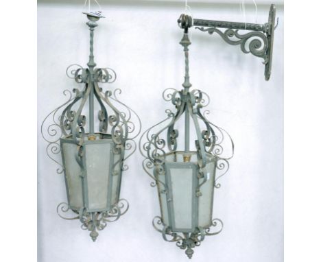 A PAIR OF VICTORIAN WROUGHT IRON HANGING LANTERNS, WITH ONE BRACKET, 85CM