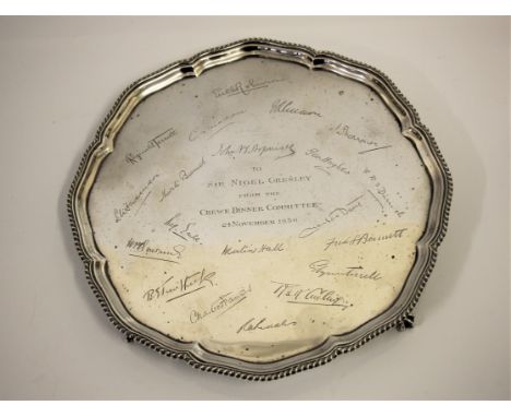 SIR NIGEL GRESLEY (1876-1941).&nbsp;A 1935 silver pie crust edge tray on four claw and ball feet made by Jones &amp; Son Ltd 