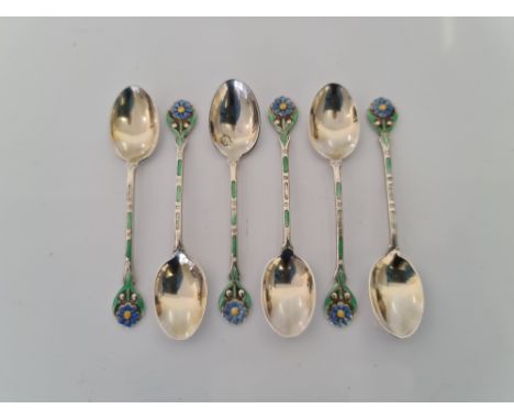 A set of six hallmarked silver and enamel spoons with flower design on handle, approx. weight 53.3gms. IMPORTANT: Online view