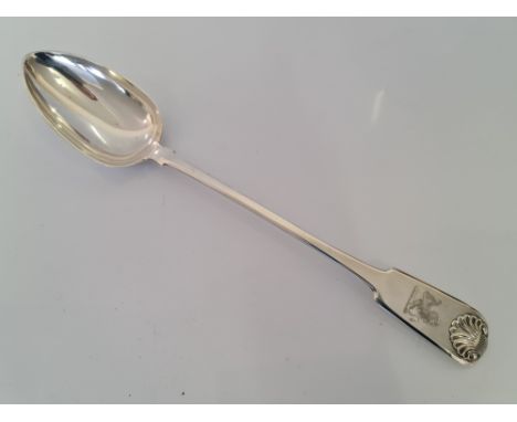 A Georgian IV silver ladle with engraved lion and scroll pattern at top of handle, hallmarked Newcastle 1823, approx. length 