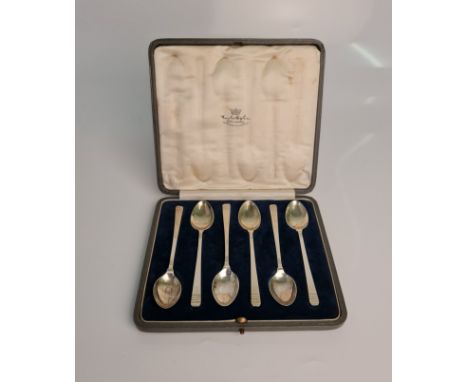A boxed set of six Art Deco silver spoons, engraved with initial 'G', hallmarked London 1931 (one 1932), with makers marks fo