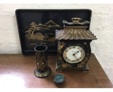 A selection of lacquerware to include pen pot, clock and tray, with small cloisonné pot decorated with dragons. IMPORTANT: On