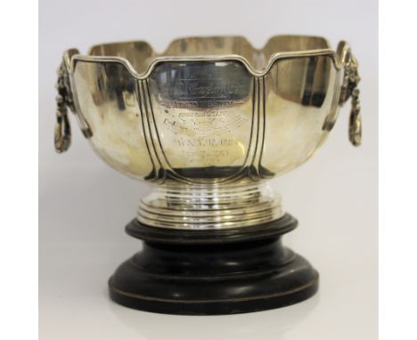 SIR NIGEL GRESLEY (1876-1941).&nbsp;A 1903 silver two lion head handled presentation bowl on ebonised wooden turned base, ins