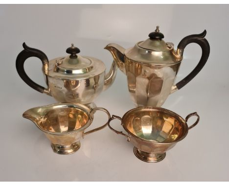 A silver Art Deco tea set, comprising a teapot, coffee pot, milk jug and sugar bowl, hallmarked Sheffield 1930, makers mark E