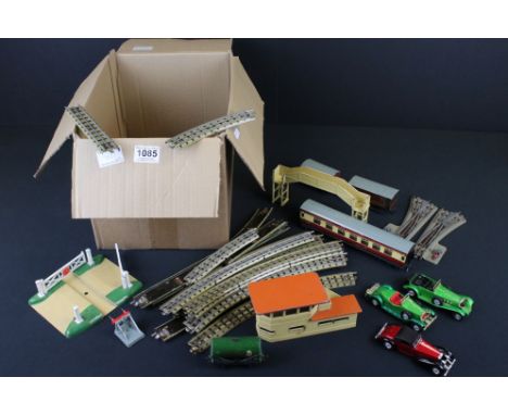 Quantity of Hornby Dublo model railway to include 3 x items of rolling stock, various track, crossroads and Trackside buildin