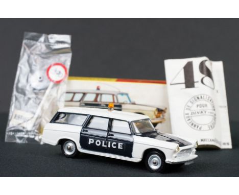 Boxed French Dinky 1429 Break Peugeot 404 Police diecast model complete with accessories and paperwork, diecast with a couple
