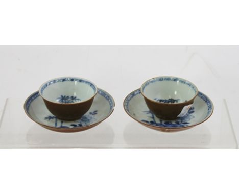 A PAIR OF NANKING CARGO QIANLONG CAFE AU LAIT TEA BOWLS with saucers, interiors painted in underglaze blue with landscape dec