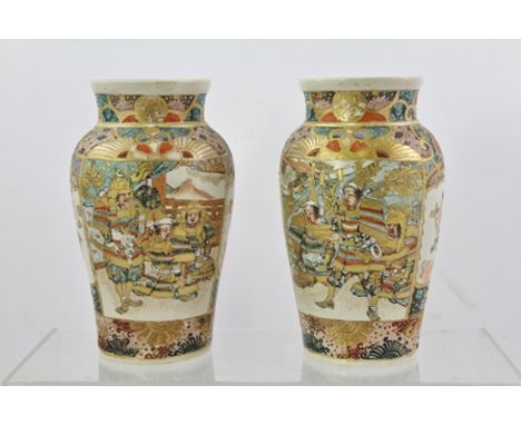 A PAIR OF EARLY 20TH CENTURY SATSUMA EARTHENWARE VASES each oviform profusely decorated in polychrome highlighted with gilt d