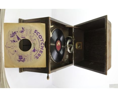 A "HIS MASTER'S VOICE" OAK CASED WIND-UP GRAMOPHONE having hinged caddy top, opening front sound doors, complete with handle 
