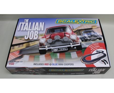 A SCALEXTRIC 'THE ITALIAN JOB' SET in sealed original vendors box, 1:32 scale complete with red and blue Mini Cooper cars, tr