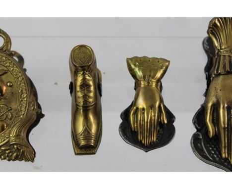 FOUR LATE VICTORIAN CAST BRASS LETTER CLIPS, one embossed with a portrait of Mercury (God of Merchants and Commerce), one fas