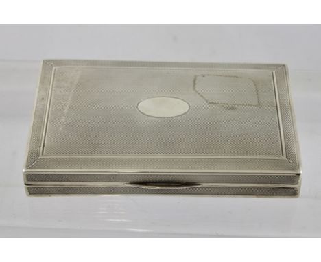 WILMOT MANUFACTURING CO. AN EARLY 20TH CENTURY ENGINE TURNED SILVER CIGARETTE BOX, cedar lined, Birmingham 1924, 14cm wide 