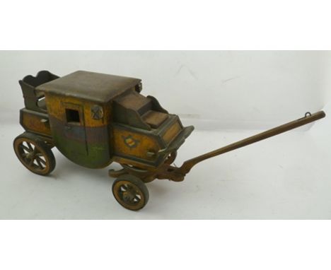 A NAIVE FOLK ART PAINTED WOODEN MAIL COACH, inscribed "Oxford-London", 18cm high, bears paper label to base, "Cathedral Art G