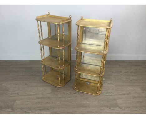 PAIR OF VICTORIAN GILT PAINTED HANGING WALL SHELVES, of 'D' shaped outline, the galleried top shelf with three further shelve