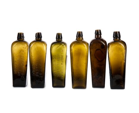 SIX MID-19TH CENTURY DUTCH GLASS GIN BOTTLES, each of tapered square form, mould blown, five with inscription, the tallest 26