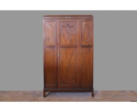 EDWARDIAN MAHOGANY WARDROBE, with caddy moulded cornice, Vetruvian scroll moulded frieze, with hanging space below enclosed b