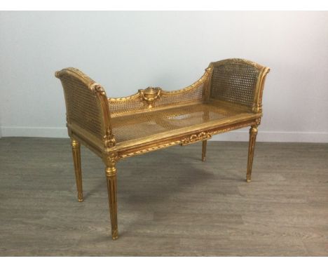 FRENCH GILTWOOD BERGERE WINDOW SEAT, the double caned raised sides flanking the double concave back with central urn, single 