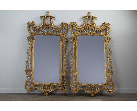 PAIR OF GILT UPRIGHT WALL MIRRORS OF CHIPPENDALE DESIGN, with pagoda cresting, C scroll and leaf moulded frieze, upright plat
