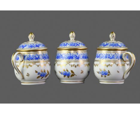 SET OF THREE LATE 19TH CENTURY CONTINENTAL PORCELAIN CUSTARD CUPS AND COVERS, each of bulbous form with hoop handle, the dome