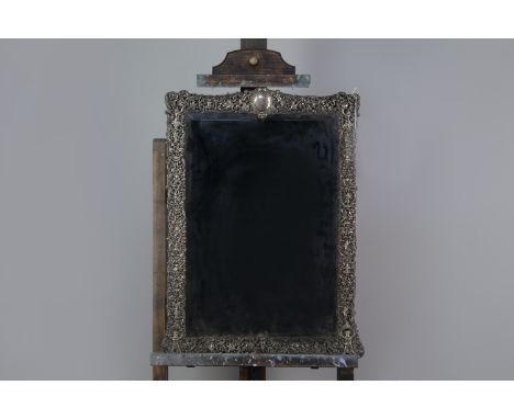 VICTORIAN SILVER FRAMED MIRROR, maker William Comyns, London 1887, the bevelled rectangular mirror surrounded by a frame cast