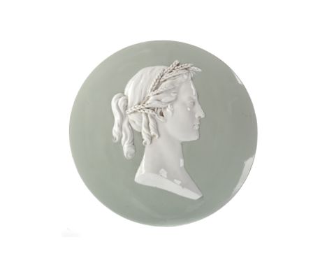 LATE 19TH CENTURY CERAMIC PORTRAIT ROUNDEL, modelled in relief as a bust length classical female with wheat in her hair, on a