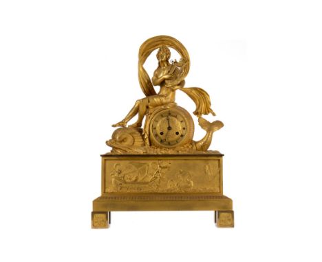 FRENCH EMPIRE ORMOLU MANTEL CLOCK, the circular dial resting against a swimming dolphin with a figure of Arion surmount, the 