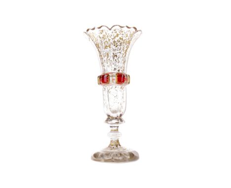 LATE 19TH CENTURY BOHEMIAN GLASS VASE, of faceted trumpet form with central ruby flashed band, above a knopped stem and facet