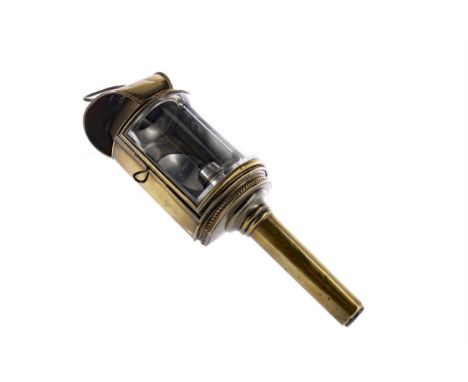 LATE 19TH CENTURY BRASS COACH LAMP, the hinged door with bevelled glass shade, hanging hook to the reverese, tapered circular