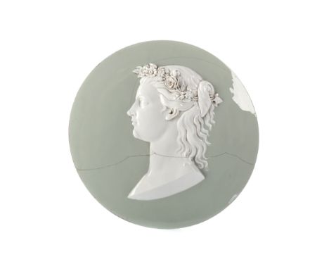 LATE 19TH CENTURY CONTINENTAL CERAMIC PORTRAIT ROUNDEL, modelled in relief as a bust length Classical female wearing a crown 