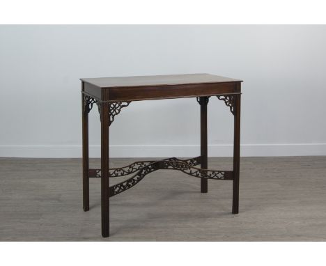 EDWARDIAN MAHOGANY OBLONG OCCASIONAL TABLE OF CHINESE CHIPPENDALE DESIGN the oblong top supported by fretted angles, on squar