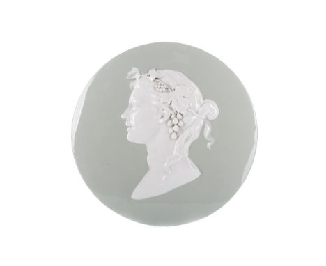 LATE 19TH CENTURY CERAMIC PORTRAIT ROUNDEL, modelled in relief as a bust length classical female with grapes in her hair, on 