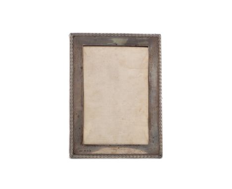GEORGE VI SILVER PHOTOGRAPH FRAME, maker Henry Matthews, Birmingham 1945, of oblong form, embossed rope twist border, easel b