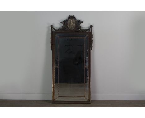 PAINTED AND LACQUERED WALL MIRROR, the pediment inset with an oval portrait, flanked by floral swags above the sectioned glas
