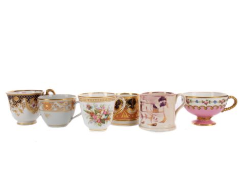 LATE 18TH CENTURY ENGLISH PORCELAIN TEACUP, with hoop handle, the body hand-painted with a floral spray within a roundel flan