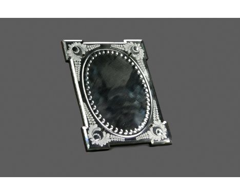 EARLY 20TH CENTURY VENETIAN GLASS MIRROR, of oblong form, the projecting corners with etched foliate decoration, easel backed