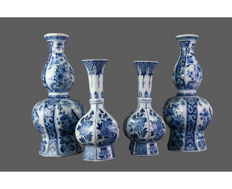 PAIR OF EARLY 20TH CENTURY DUTCH DELFTWARE BLUE &amp; WHITE VASES, of faceted double gourd form, hand-painted with birds perc