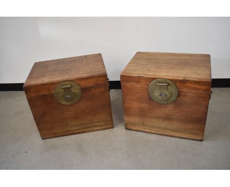 A pair of Oriental Hardwood travel cases, having hinged lid, with internal pull out shelf, large brass clasps to front and ha