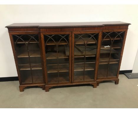 A first half 20th century mahogany and glazed bookcase, 183cm wide and 113cm high 