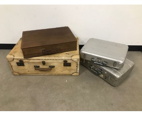 Four travel cases, including two flight cases by Halliburton, AF, a white calves leather trunk and a brown example (4) 